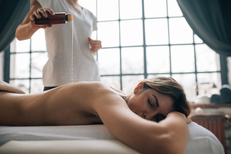 A serene spa setting with oil pouring for a relaxing massage experience. Perfect for self-care and relaxation themes.